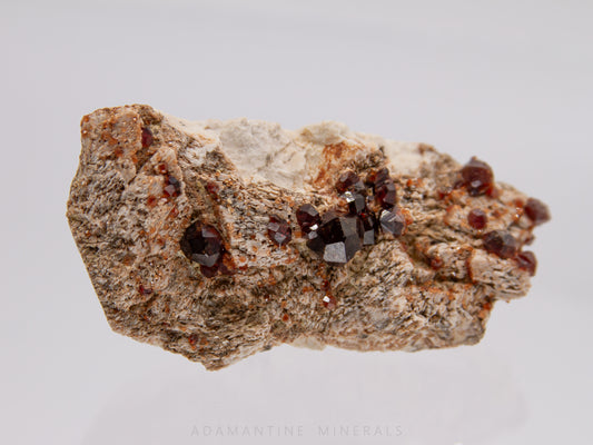 Spessartine Garnet on Microcline