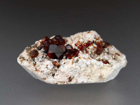 Spessartine Garnets on Microcline