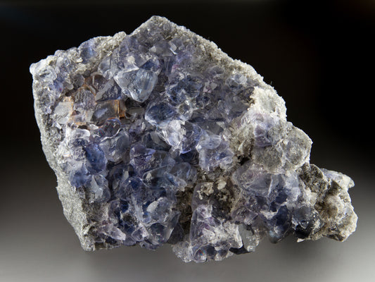 Blue fluorite crystals on matrix with octahedral crystal formation
