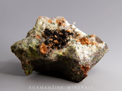 Microcline Var. Adularia, Epidote, and Tenorite-Coated Copper