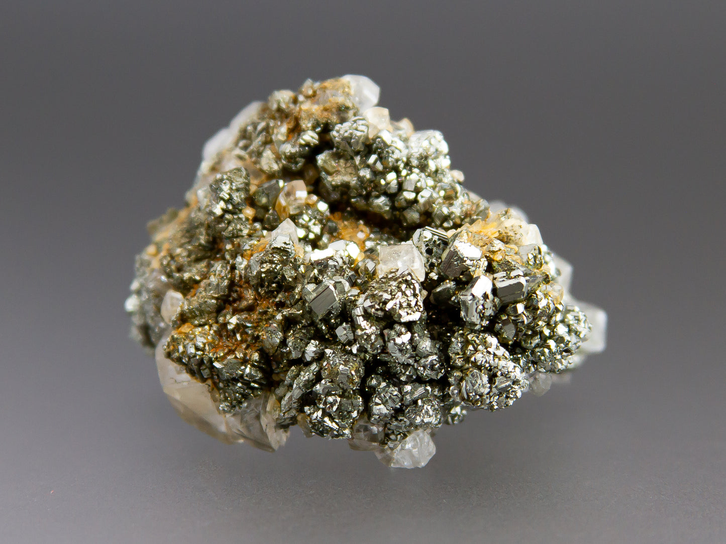 Mineral sample with crystal structure on a gray background