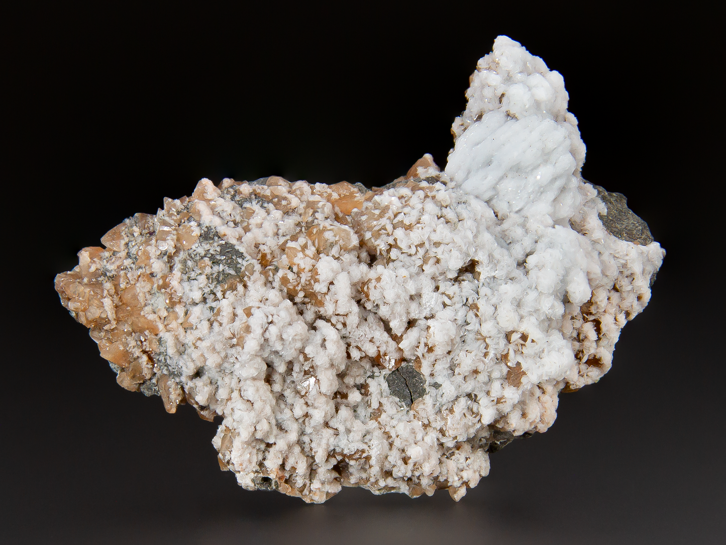 Mineral sample with white crystalline structure on a dark background
